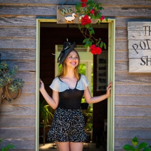 victoria-rose walking through a door feeling confident and smelling a rose because she has got it done